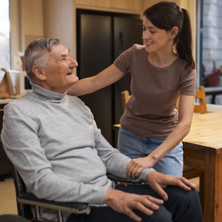 elderly-person-being-taken-care-by-female-caretaker-min